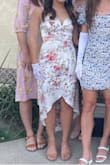 This was a beautiful dress! Nice material but prone to wrinkles so good to steam before use. I am in between XS & S because of my small bust & this was a bit too tight at the top of the rib cage but loose on the front of the bust. I also recommend wearing a low cut bra as the slit in front is quite low. - Nicole S.