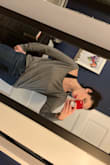 I love the material so much I got two. I have somewhat broad shoulders though so I sized up in gray to actually get an off-shoulder drape. The neck size is just a tiny bit small in proportion to the shirt for me. I kept small in white because I didn't want a bigger size to make me look like a marshmallow. - Amber S.