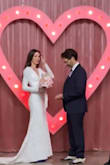 I normally wear a XS in al lulus dresses. This one happened to run large in the arms and waist but most wedding dresses must be fitted anyways so that wasn't a problem. I took it to my tailor and had the shoulders, arms and waist altered to my measurements . Got many compliments on it. - Lacy G.