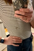 For reference, I run between an 8 and 10 in jeans and am pear-shaped. Until this purchase, the majority of all my body suites have come from Express, where a size medium fits perfectly. However, I always size up when ordering online. The first time I wore this it was a bit snug, mainly bc the bodysuit wasn't as long as it could be for my height, but it wasn't so bad that I couldn't make it work.  Unfortunately, the material ripped on the second wear as I was attempting to adjust myself after using the restroom, and once it ripped in one spot it began ripping in other places as well. And to be clear there was no seam where it ripped, as you can see in the pic, just a random spot on my shirt. Super disappointed. - Brittany B.