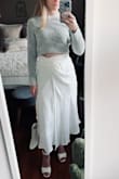 I was actually really surprised at how well this fit my waist. Most skirts, dresses, and pants are loose on my waist but this fit great.
The ONLY thing I don't love is the "knot" design, it isn't flattering in the stomach area. It just sticks out too much and there's not much you can do about it. 
I think it may be slightly better after being ironed but overall the knot wasn't the best design choice. - Alexa W.