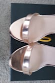 I listened to other reviews and sized down (I'm usually an 8 but sometimes a 7.5) to 7.5. Too small. Bought 8 instead and they were almost identical, maybe a millimeter longer. I kept them since it was too late to size up and my feet were killing me all night, though buying ball-of-foot cushions helped. Pic shows 7.5 and 8 side-by-side. - Marisa R.