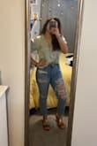 I was worried about the fit of the shirt because I have broad shoulders but it looks amazing. I matched it with high-waisted pants, love the color. It is easy to wrinkle but it irons out fast. - Jennifer D.