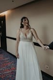 What I most like about the dress is the price. You are not going to find such a deal for this kind of dress anywhere. I had to modify the straps because they didn't fit my boobs, the dress came without two sparkles but honestly, they weren't noticeable (having so many). I hadn't realized until I saw the photos of my wedding that the skirt is a bit transparent. The dress looks expensive. - Paula R.