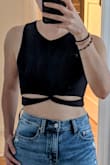 It's a solid sports tank although I haven't put it through a workout yet. I feel secure in it and the fabric is smooth. I wish it had cups sewn in it though because I feel bulky with a sports bra underneath. - Beatriz K.