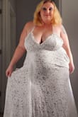 I got my dress in the mail within a week and it came so fast. I was so happy to try it on and see how it fit. The bodysuit was different, I never wear them. I'm very glad there is a bodysuit so you don't worry about anything showing. My only thing is I have a big chest, so I'm going to be looking into a silicone bra most likely to hold the girls up. Other than that it's perfect and I can't wait for the day to come I spend the day in it for our wedding this fall! I haven't fully done my hair up or anything yet because I'm a busy mom and want it clean and ready for the day. - Sarah M.