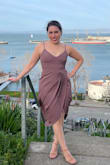 This is a size small. I ordered 12 dresses for a wedding. This one was the winner. No hemming is needed. Flattering as it hides the tummy. Didn't wear a bra, but can't go commando in this with that slit. Glad I didn't because it was a windy day in SF! The only thing is the dress wouldn't lay completely flat on the back as you see in the pic, probably because of my butt. Not a real issue to me though. Overall would recommend it! - Elora S.