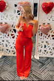I LOVED this jumpsuit. It was a bit out of my comfort zone but was worth it as it was extremely comfortable and way more flattering than I expected. It fit me tighter than the model and I thought it would display my stomach in an unflattering way but the way the top flows and the material of it didn't negatively accentuate it at all. It stayed up just fine although I did notice it got more booby than I expected when I actually moved around and didn't just pose in front of a mirror ;) I wore it to my Valentine's Day bridal shower and got so much love on it! - Hayley W.