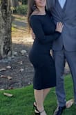 So I loved the dress the minute I tried it on. The bottom part of the open back is metal so it keeps the dress form. The only issue I had was the dress kept riding up. Since there isn't a slit anywhere on the bottom it would ride up each step I took. I felt like people noticed me pulling it down. - Tracey S.