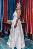 When I saw the dress I knew I wanted it bc I wanted satin. It's really beautiful and at a wonderful price. I had a lil trouble with the zipper.. it is difficult to zip once it gets to the waist belt and you have to try a little harder but it will zip up. Other than that perfect dress. The pockets are perfect for holding the ring till it's time. - Alana T.
