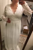 I first ordered a large and was unable to zip it all the way, so I exchanged it for an xlarge which fits great! Because I'm so short I will have to get it altered, and the top & sleeves will need to be taken in a bit, which will be a simple alteration. Love the lace and how elegant and beautiful I feel in this dress! I've grained a lot of weight over the year and have struggled with body image/positivity, but when I'm in this dress I feel stunning. It's so comfortable too! I don't even need to wear a bra and you cant notice! I also love that Lulus lets you try on dresses and return for free within 10 days. I ordered multiple dresses to choose from for my wedding and this was the one. The return and exchange process was very easy and knowing so makes me want to buy more Lulus! - Korshye L.