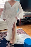 Love the bell sleeves but very impractical when it comes to eating. The large felt like a medium on me. I wasn't a huge fan of the slit in the front. The top is absolutely gorgeous. The dress just wasn't for me. - Korshye L.