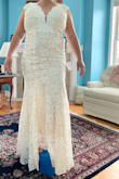 The large felt like a medium and I was suffocating a bit when I tried it on. It's a gorgeous dress but having a little tummy made me feel uncomfortable in it due to the tightness. The top is beautiful. The dress just wasn't right for my comfort and body type. - Korshye L.