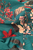 The dress is pretty but the colors are very different from the pictures shown. Much darker green and more burgundy in flowers. Not red. This dress is way off from what is shown. - Melissa A.