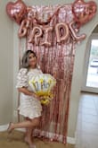 Bought this dress for my bridal shower and I received many compliments on how beautiful it looked & how nice the material was. I felt comfortable and I especially loved the ruffle at the bottom. The dress is short but that's what I wanted! - Jaxx E.