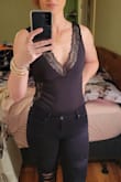 I finally wore it with ripped black jeans and a Lulus blazer and felt super cute and sexy. I went no bra because my girls are not huge, never were, but after baby lost their umph a little, lol, so nothing to worry about. Plus the medium once snapped fit snug to hold them in place. I can't size down, it would cut me in half, lol. Love this piece! - Tiffani T.