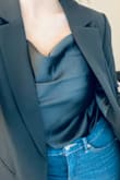 I love this top so much!! I wore it to a concert and have also worn it to work with a blazer. Very versatile. I didn't experience the issue with the lining showing, like mentioned in other reviews, but it may be because the dark black color conceals it better. Definitely going to order it in other colors too! - Amber L.