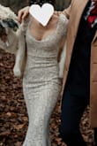I was so nervous to order my wedding dress online, but this one fits like a glove. It feels super soft and stretchy, I loved the way my body looked in it. Everyone was astonished that I ordered it online!
Because our wedding day was rainy and we walked through the park, the hem of the dress got super dirty, but that kind of added a super vintagy-ombre touch to it (also, it all washed off afterwards).
If you order this dress from Germany/Europe in general, be aware that you will probably have to pay extra for customs, I think I payed another 40¬ or so. Still, well worth it! - Emilie G.