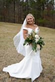 I ordered this dress as my wedding dress, i just had a small ceremony, in a 8 and it fit perfectly! i was shocked at how good of quality it was. i did have to get it taken up but i am short. so easy to take up as well. if youre thinking about ordering this, do it! - Emma B.