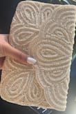 This clutch will be absolutely perfect for all of my wedding endeavors! It's a little heavy because of the beading, but it's so gorgeous and has just enough room to store things. Overall it isn't too big- Love the strap it comes with too! - Emily V.