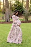 I got this dress for my maternity pictures and it was perfect! I am normally between a medium and a large and went ahead with the large for my bump. At 34 weeks, it was still more than enough fabric, and the fact that it's a true wrap makes it very adjustable. I did have to safety pin the bust area, but nothing too complicated. Absolutely a gorgeous dress and photographs beautifully. - Paola S.