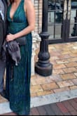 Material doesn't wrinkle, so packing for the trip wasn't a worry for the flight. Fit is amazing and had tons of compliments through the night! - Melissa F.