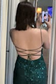 It's so pretty. it fits well and the back I'd gorgeous. the only problem is that I have to get the end of the dress hemmed because it's a little long on me. other than that, beautiful dress. - Madeline R.