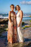 I had a small beach wedding and wanted the perfect tropical dress for my bridesmaids. The dresses were beautifully made and the fabric is of good quality. They both used some fabric tape in the bust area to prevent any mishaps. We had been in the water so that's why the bottom portion is darker. - Lori O.