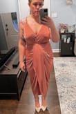 This dress hugged all the right places! The surplice skirt and the center ruching make it easy to enhance your curves in the best way. The material is clingy but in the right way. Being busty and petite, I had to pin the bust just to make sure I was secure on the top. - Kari B.