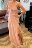 I love the style, the slit, the flow. It is not too thin or cheaply made, yet half the price of many other brands. The color is a slightly dusty medium blush that is perfect for my friend's wedding. It's slightly roomy in the bodice but fits nicely in the hips. I thought about having the straps taken in a touch but think I might leave them. It is quite long on me even with heels, so I will definitely be having it taken up. Can't wait to wear it! Lulus always comes in clutch whether it's for bridesmaid duties or vacay dresses. It came quickly and my returns for other styles were easy and fast. - Cydney K.