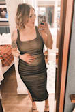 I got this dress to wear on my birthday. I read some reviews from other women who were pregnant and liked this dress. I am 23 weeks and I'm glad I got it! It was very comfortable. I typically wear a size 6 and a M top, I got a large, which I typically do with dresses so I can have them tailored. But, I didn't need it. It fit me and baby perfectly! I think I could wear this for a while longer if needed. The fabric is stretchy but not thin and cheap! Worth it! - Taylor A.