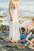 As soon as I tried this dress on, I knew it would be perfect for our family photo session in Hawaii. The embroidered details are in just the right spot to avoid wearing a bra. The lining didn't allow any show-through with nude panties underneath. The fit was spot on (forgiving at the midsection) and I liked the touch of color at the hemline. The floral pattern was helpful in coordinating other outfits to the color scheme as well. Would definitely choose this one again! - Melissa K.