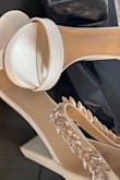 I love these shoes. Haven't gotten a chance to wear them yet. We're getting married in April but when I tried them on they seemed comfortable. I will say that the craftsmanship isn't the greatest, the jewels are starting to come off and that was coming out the box. Kind of a bummer. - Brittany C.