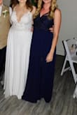 I wore this as a bridesmaid dress in 2021. Its a wonderful dress and highly recommend. I will say it was a tad bit large on the top. I'm typically a medium but will go with a large if its a tight fitting dress. This dress isn't tight fitting though so I went with medium. However, my mom had to tack it on the front because it would just show everything if it wasn't. I don't have much of a chest either so I have to do that with dresses sometimes. Otherwise, its a great dress! - Lori B.