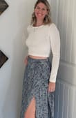 Love the length. There is a bit of stretch in waist. The hips dip out a bit more than I like but you don't really notice it. Overall great skirt! - Amber A.