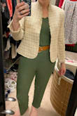 I love this jumpsuit, all other reviewers are right, it is versatile and comfortable, the material is forgiving and soft. However, I get cold easily and am also self-conscious about my arms, so I usually bring a sweater when I go out. The tie straps make it awkward to wear anything over this. I tried sweaters and a blazer and even tried untying and retying the straps so the knot was lower but then I look like I have weird bunny ears growing out of my armpits. I wish the knots were "faux" and could be removed but they are functional and necessary to keep the top up unless I bust out a sewing machine. - Nicole B.
