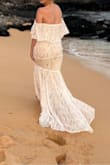I bought this as a maternity wedding dress since many reviews mentioned how loose it was in the midsection. I usually wear a small/medium but since I'm 7 months pregnant I bought a large and it accommodated the bump well. The material isn't stretchy and it was a little difficult to zip up (cheapy zipper) but it looked great. It was long enough too for my height 5'10 without heels. I think if I were to buy this as a regular wedding dress it'd be worth it to have it altered so it fits perfectly. - Holly