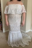 I said yes to this dress yesterday!! I will be wearing it for my June wedding, which will be outdoors so I wanted something that I would be comfortable in without overheating. You can't see my face in the pictures but I am BEAMING. The train is absolutely gorgeous and I feel like a total princess. I looked at a lot of lace dresses and I loved that this one was kind of a more modern take on lace, with a more geometric pattern instead of the typical flowers. I'm not wearing any shoes in the photo, but will probably need to get 2.5" heels to make sure I don't trip (I tried it on with 2" heels and the edge was right on the floor, so it may be just right for you taller ladies!). I will say I was on the edge about whether or not to order this, so if you're not quite sure yet just try it on! It's definitely worth ordering multiple dresses and then returning what you don't like. I'm really glad I took the chance because I can't imagine getting married in anything else! - Vanessa F.