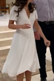 I loved this dress for my rehearsal and rehearsal dinner! It flows and is very comfortable! I am glad I ordered an XS after reading other reviews because the top fit my chest perfectly. I usually wear a small and do not fit in XS. Would recommend! - Madeline C.