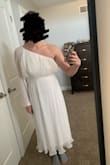 After reading the reviews, I knew to expect this dress to be on the larger size, so I sized down. Despite this, the top portion of the dress did not fit at all, and actually seemed to bunch up in random areas (see pictures for reference).  The skirt did not hang properly, making it seem like it was not sewn properly or just made improperly. Did not hang naturally at all and the top looks like a balloon with random areas of added fabric. Very disappointed in this as it will be too costly to have it altered as there are so many problems, and I am from Canada making returns difficult. - Samantha M.