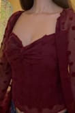 It's elegant and sexy at the same time. Nice material. You could wear it without a bra as it's not see-through. The square neckline is somewhat wide so the bra straps show a little. - Cindy S.