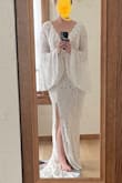 Love this dress and can't wait to wear it at my courthouse elopement and for a photo shoot at a state park. It was a bit larger than expected (normally Lulus size large fits me well, but not this model). I will tailor it so it has a bustle for the small train, adhere the beige under layer to the top lace layer where the slit is, and get the waist and arms taken in. - Hailey E.