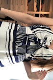 I am excited to wear this out. It does fit true to size, I ordered a small. The top seems to stay in place well for a strapless. 
Very happy. - Annelise R.