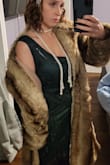 Everyone loves this coat and the Fur is very authentic feeling, it doesn't feel like waxy plastic. I've worn this 2 weddings, a Christmas party, and even as part of a 20's flapper Halloween costume. Only downside is it doesn't stay closed in the front, And I could have probably bought a bigger size to allow my arms to stretch out better. - Samantha O.