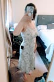 I'm really pleased with this dress! The embroidered fabric is gorgeous and it's just long enough without making me look too short. Definitely will have to wear with heels but I was planning on that anyways. My only complaints are the straps slide off my shoulders but I have narrow shoulders already and there is an easy fix by tying it differently in the back. Definitely not a deal breaker because the ties are super long which I think makes them more workable. Also the top isn't as lined as I need it to be. My chest fits fine for fit but I'll probably need to invest in some sort of tape just in case. Either way, I was looking for a bridal shower dress and this is the best dress I've tried on for the occasion by far! The back is STUNNING. My picture doesn't do it justice. - Courtney F.