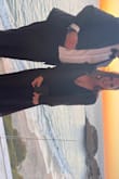 Wore this beautiful gown to a black-tie event and it was perfect, even tho the pic doesn't do it justice. It shows a fair amount of cleavage but holds up nicely. I'm pretty short, so I had a seamstress hem it. Other than that, it fit perfectly and I received a lot of compliments. - Christine K.