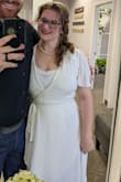 I initially ordered a M and I'm kinda sad the bust is so restrictive because the M fit the rest of my body amazing! I had to send it back because I absolutely needed coverage on my bust. If you're in between choosing and are busty, just go ahead and size up if you need more modesty.
* I did end up getting a full slip and pantyhose and that definitely helped the coverage. It worked perfectly for how simple we wanted to keep our wedding! A beautiful and timeless homage to a vintage style. - Ashley P.