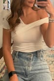 Love everything about this!! Material is a little thicker so it's not see-through (had a light pink bra on in pic). It's tight but not too tight, and the one-shoulder is so cute! I will say with my height I'm never able to snap the buttons at the bottom, but that's normal for me. - Gabrielle B.