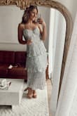 I ordered this as a bridesmaids dress and absolutely love it, however it runs big and has too much fabric up top. I am small chested (34B) and don't think the extra fabric would even be solved with a larger chest - it's just odd. Ideally, I would order a smaller size but think this needs seamstress help to get a proper fit and fix the number one issue which is the awkward extra fabric. - Jozy C.