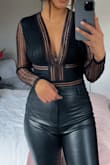 I ordered both a S and M because I feel like I have a longer torso. M definitely fit a lot more comfortably than a S. Material is stretchy and hugs the body nicely. I wore it for my birthday dinner with faux leather pants and I got so many compliments. Such a cute black shirt to have. - Rebecca